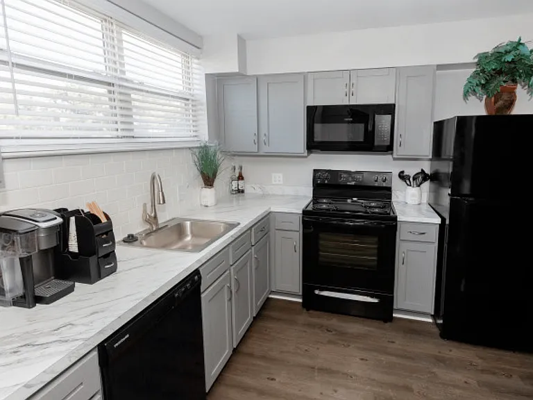 Explore this beautifully designed kitchen with modern appliances and elegant finishes.
