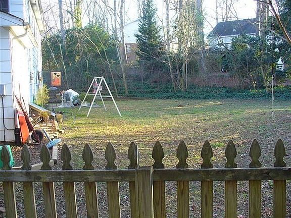 Part of fenced in backyard