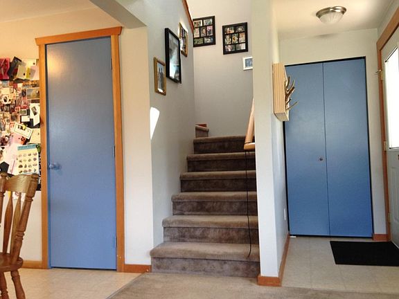 These are the stairs that lead to the upstairs, and to the left of the photo is the dining room.