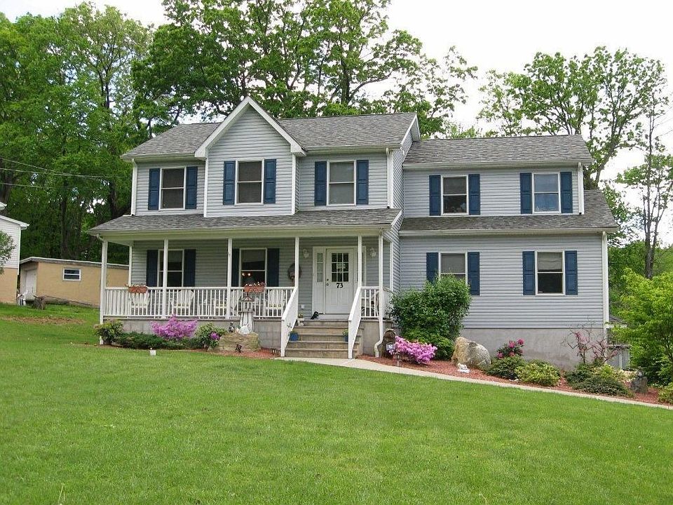 Young Colonial with rocking chair front porch