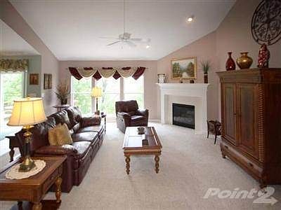 The extended great room offers a corner, gas fireplace with ceramic surround & custom mantel. Vaulted ceilings with recessed lights & fan. This home was extended 4 feet across the entire rear.