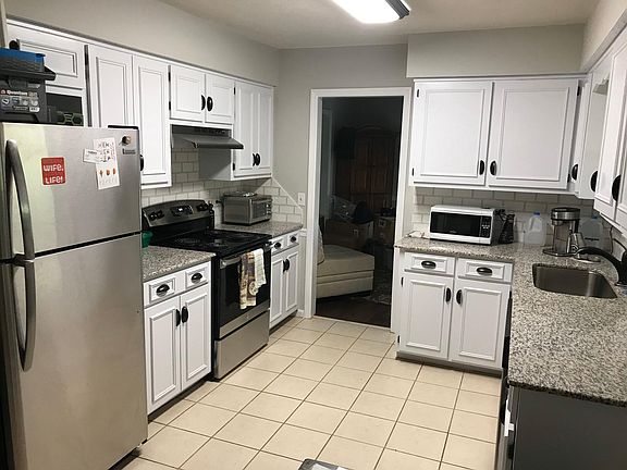 Bright kitchen recently updated with stainless steel appliances, new cabinets, granite countertops and tile backsplash.