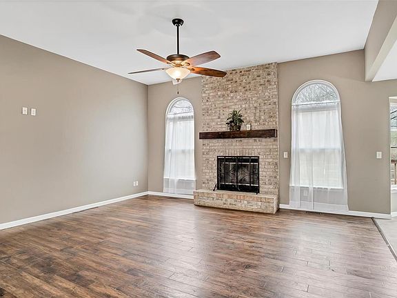 Great Room with 10' ceilings & floor to ceiling wood burning fireplace.