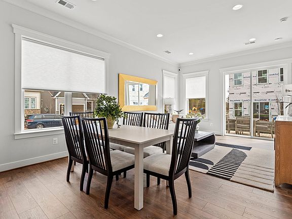 The main level featuring the dining room, and great room in the Beaumont model by Brookfield Residen