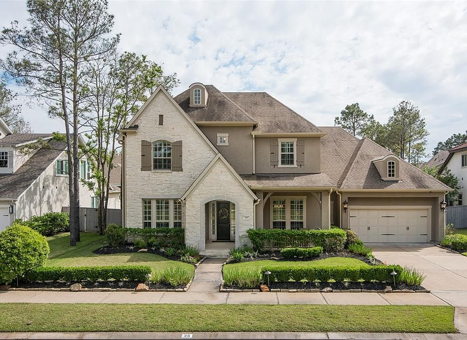 35 Liberty Branch has great curb appeal! This Weekley built stone and stucco elevation is quite impressive!