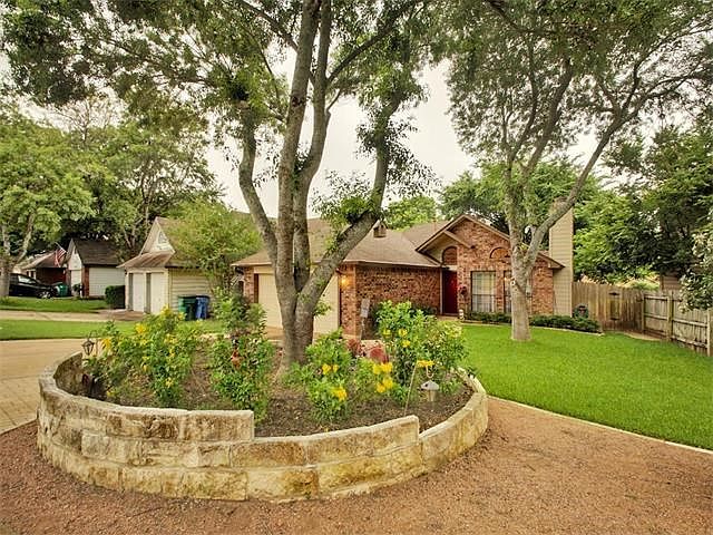 Talk about curb appeal! - Beautiful blooming landscaping with masonry