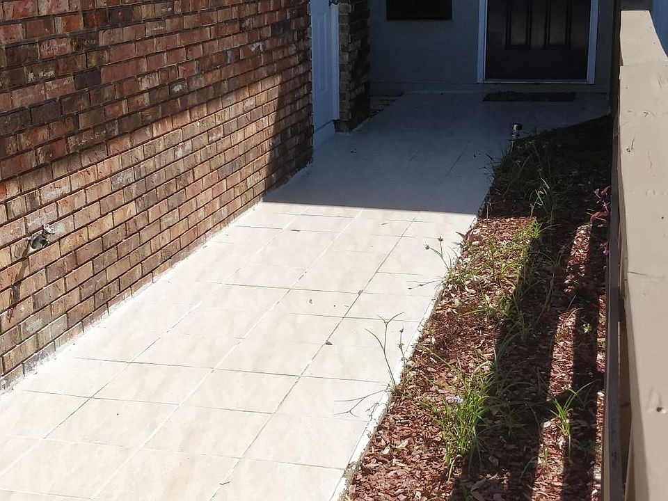 Tiled walkway from garage to front door.