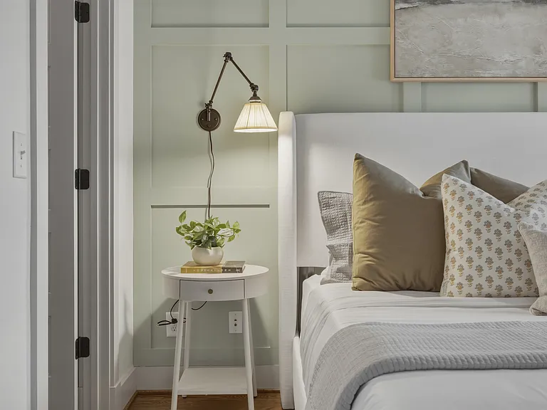 King sized bed in bedroom 2, featuring a walk-in closet, dresser, smart TV, full-length mirror, and ensuite bathroom.