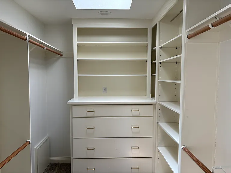 Primary beroom walk-in closet