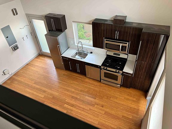 view of kitchen from master bed loft