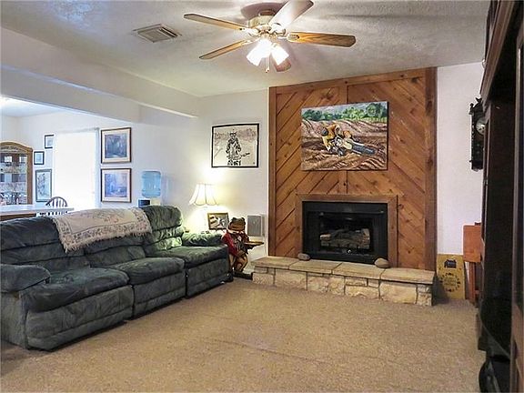 Wood surround gas fireplace in this living room!