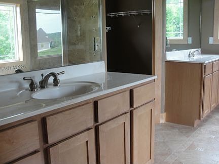 His and her vanities & walk-in closets in master bath
