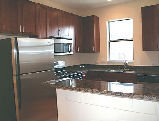 Kitchen with granite countertops and stainless steel appliances