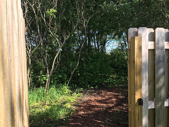 With gate access to bike trail.