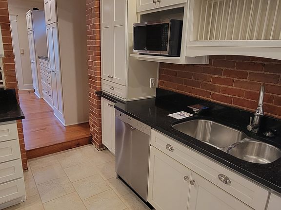 Kitchen with built in plate rack