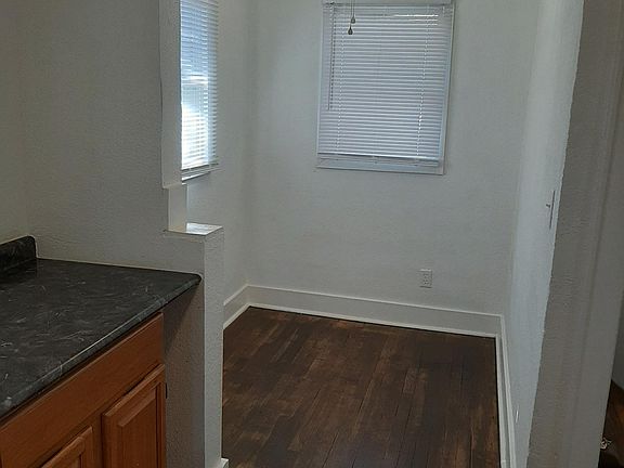 Kitchen view into dining area; 2nd floor balcony is outside these windows