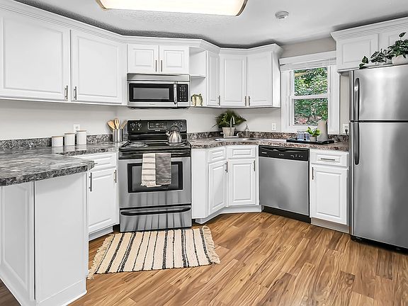 Elegant stainless steel appliances add modern style to our charming kitchens at The Willows.