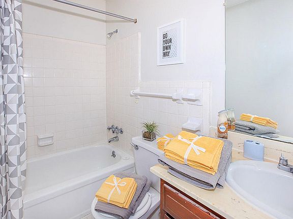 Experience the tranquility of a bright and inviting bathroom oasis.