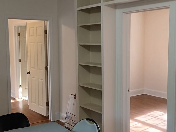 There are plenty of shelves in the family room.