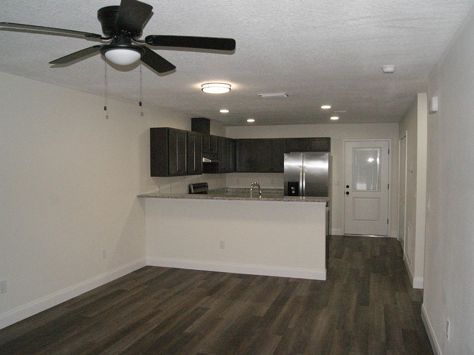 Walking into front with living room and large kitchen