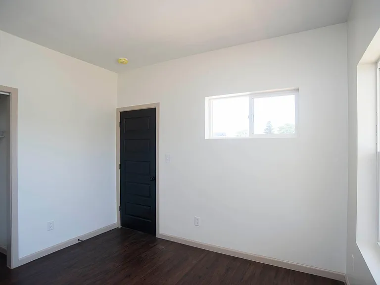 Downstairs bedroom or study with street facing and east facing windows