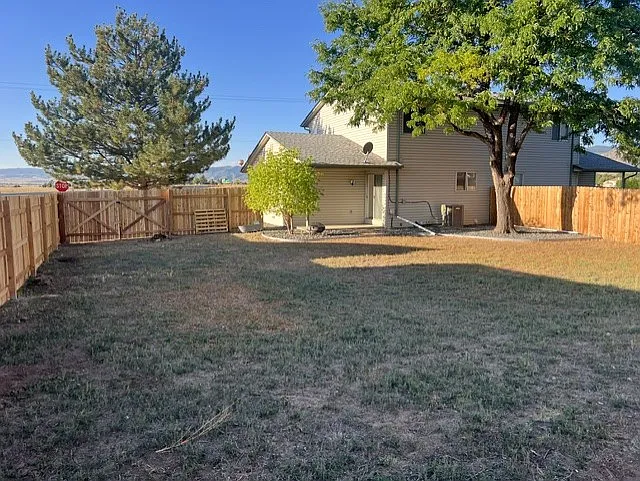 HUGE FENCED IN BACK YARD WITH DOUBLE GATES FOR RV, BOAT STORAGE ETC.