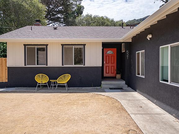 Street view of house. Main entry to 4 bedroom house. Your entry is through the left gate.