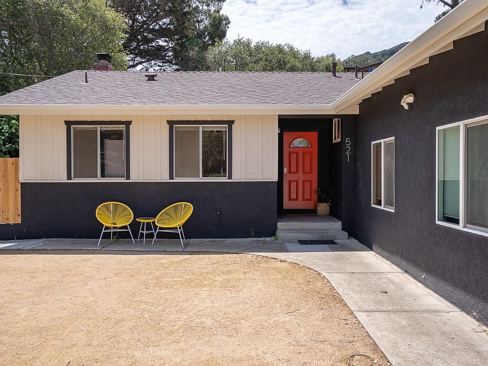 Street view of house. Main entry to 4 bedroom house. Your entry is through the left gate.