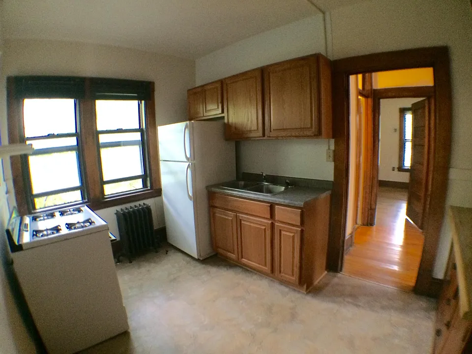Kitchen looking past bath located on left and into Bedroom 2