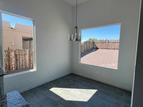 Room for dining room table next to kitchen.