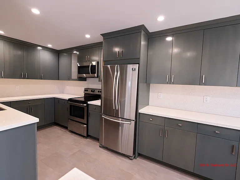 Large Kitchen with Quartz Counters, Stainless Steel Appliances and Custom Cabinets. Pictures Don't do the Size of the Kitchen Justice!