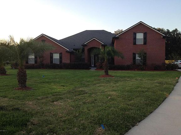 Front of Home w/Palm Trees