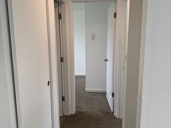 Hallway to bathroom and bedrooms
