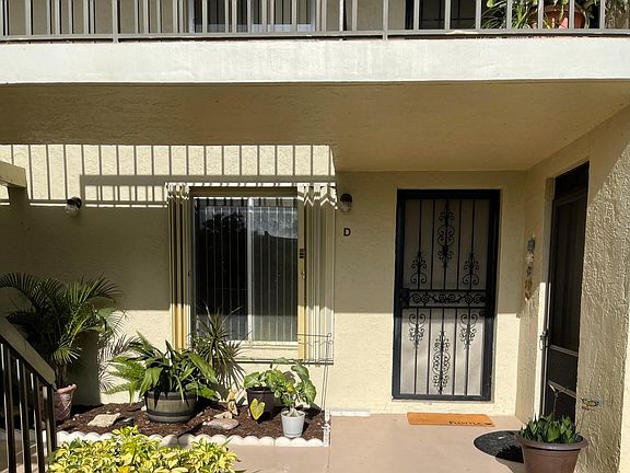 Front door with security screened door.