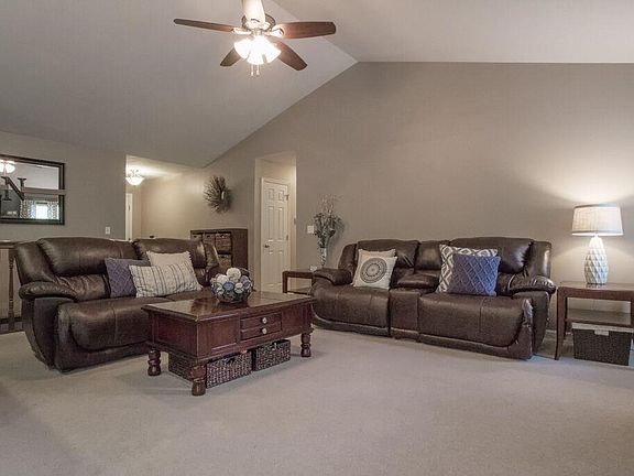 Great room with Vaulted ceilings open staircase!