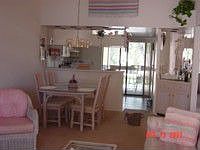 view from living room of dining area. 15 '+ cathedral ceiling overhead.