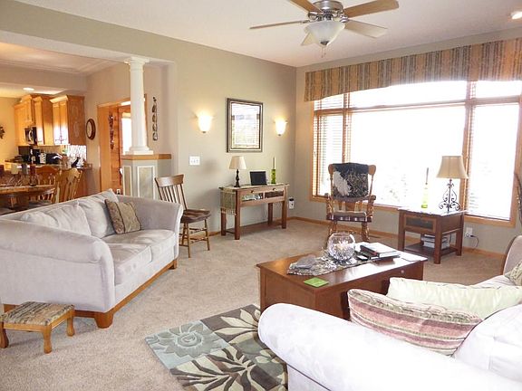 SUN FILLED MAIN LIVING AREA  Opens to foyer and Dining. Makes you want to stay and sit awhile. Freshly painted & newer carpets