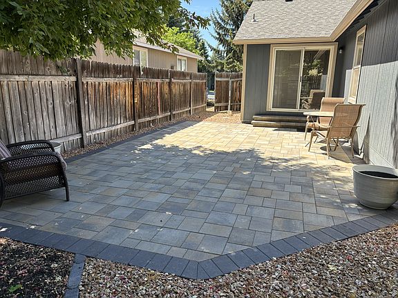 Newly landscaped backyard paver patio
