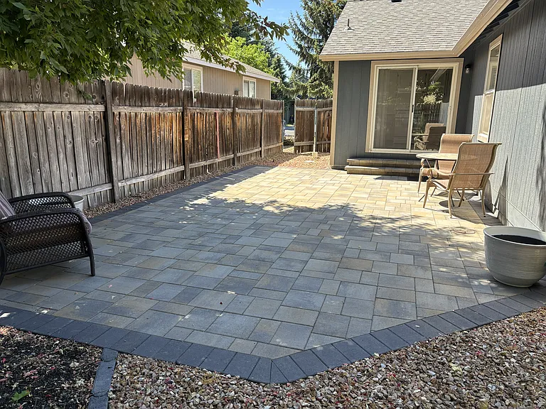 Newly landscaped backyard paver patio