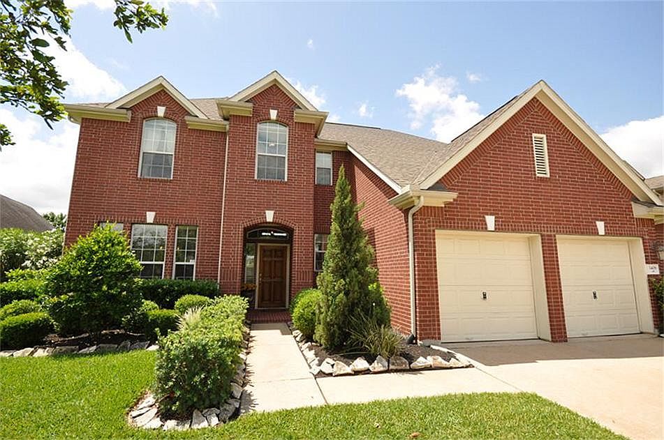 With a tall roof, beautiful brickwork and fresh landscaping, this home has great curb appeal.