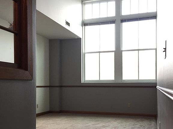 Bright living room with high ceilings and new windows, and now BAMBOO FLOORING, too!