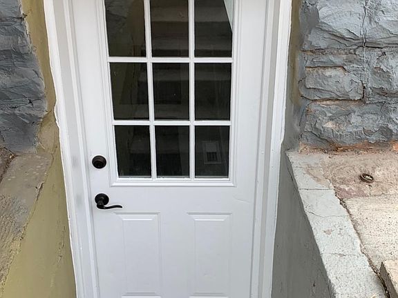 Front door of basement. There is a back door