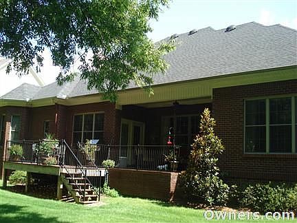 Rear of the home has covered patio and composite deck