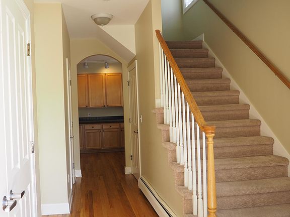 Entry. Coat closet on left. Kitchen straight ahead. Door to lower level on the right side and 1/2 bath on the left side.