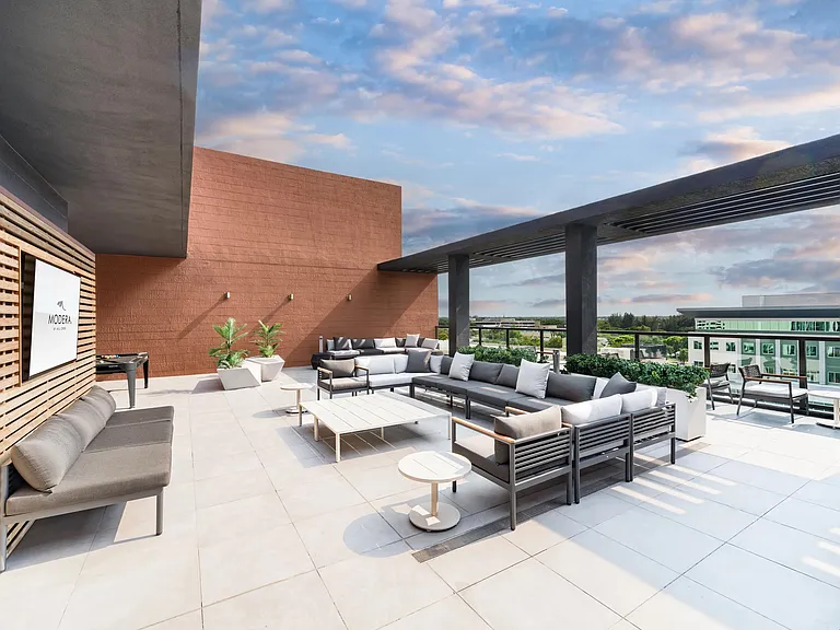 Rooftop terrace with shaded lounge seating, open-air gathering areas, and expansive views creating a comfortable setting for relaxation and conversation.