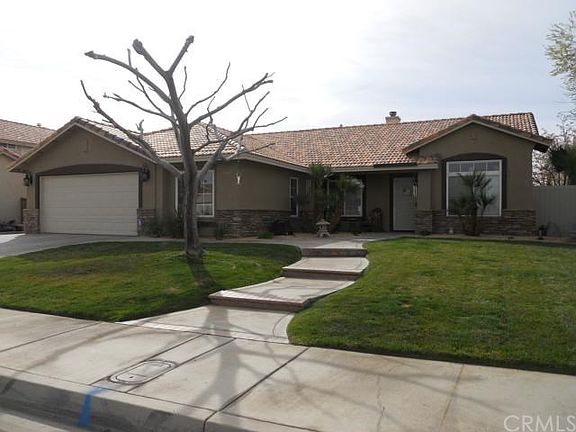 Amazing curb appeal.  That large tree is a Mimosa Tree and absolutely beautiful in full bloom