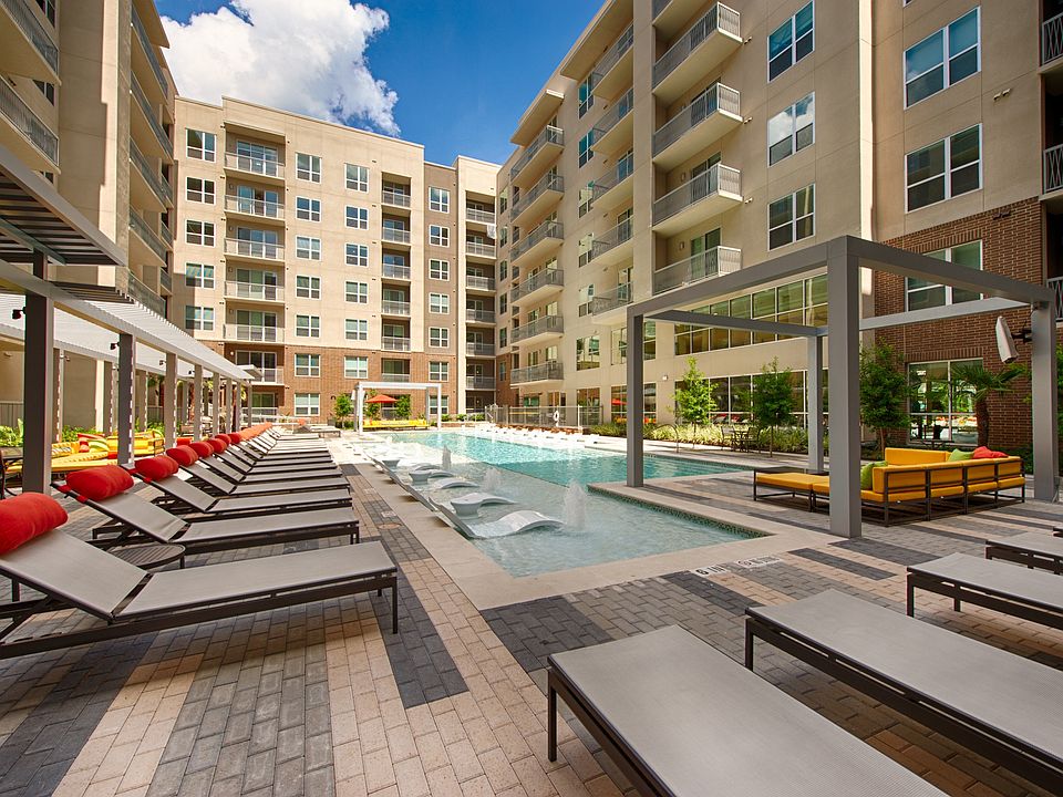 Modern apartments surround a sparkling central pool.