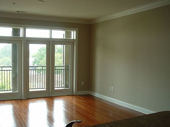Gorgeous hardwood floors leading to balcony