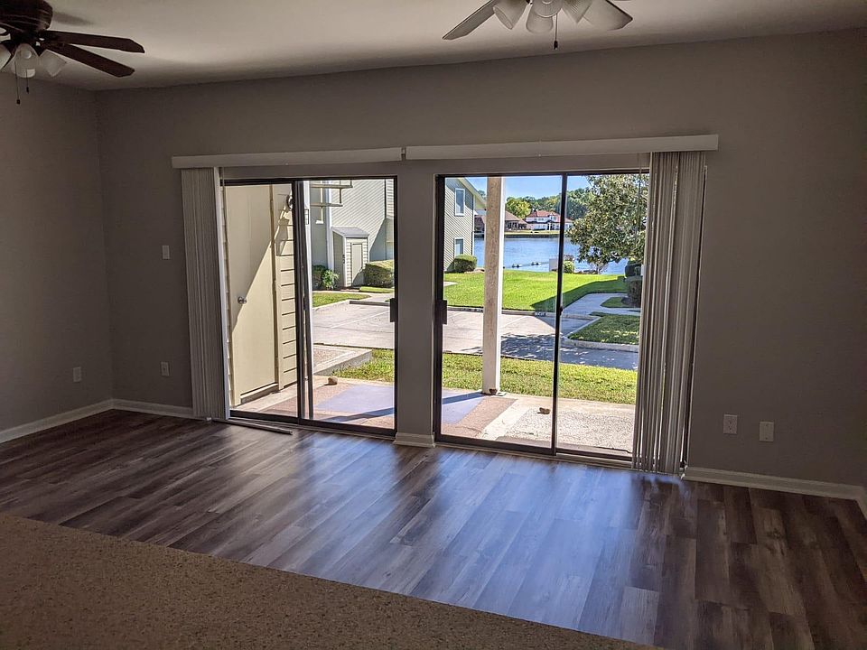 Kitchen view, through the living room and onto the lake.