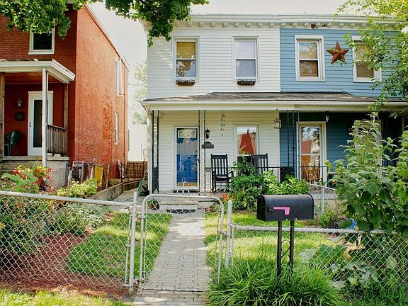 Fenced yard and cozy front porch.
